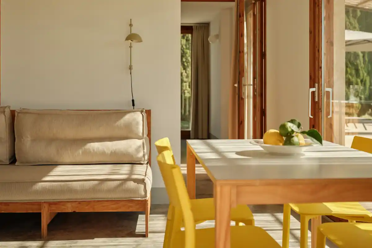 Table and sofa deluxe duplex apartment Sa Nau Agroturismo